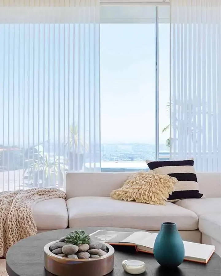 Sheer vertical window treatment across a wide living-room window