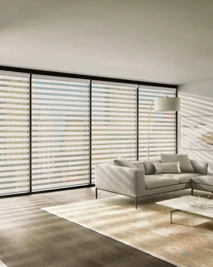 Layered zebra shades with alternating sheer and solid horizontal bands